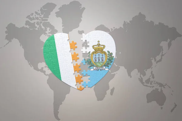 puzzle heart with the national flag of san marino and ireland on a world map background.Concept. 3D illustration