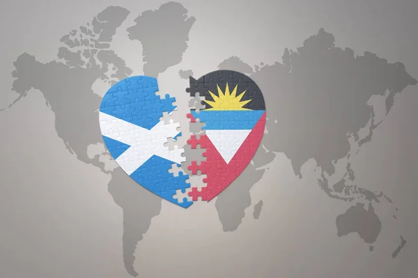 puzzle heart with the national flag of antigua and barbuda and scotland on a world map background.Concept. 3D illustration