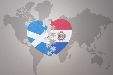 Bir dünya haritasında Paraguay ve İskoçya 'nın ulusal bayrağıyla bulmaca kalbi. 3B illüstrasyon