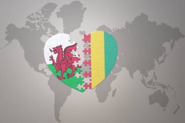 Bir dünya haritasında Gine ve Galler 'in ulusal bayrağıyla bulmaca kalbi. 3B illüstrasyon