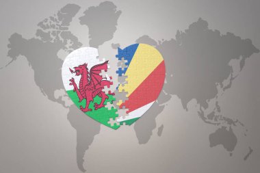 Dünya haritasında Seyşel ve Galler 'in ulusal bayrağıyla ilgili bir bulmaca kalbi. 3B illüstrasyon