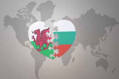 Bulmaca kalbi, dünya haritasında İspanya ve Galler 'in ulusal bayrağıyla birlikte. 3B illüstrasyon