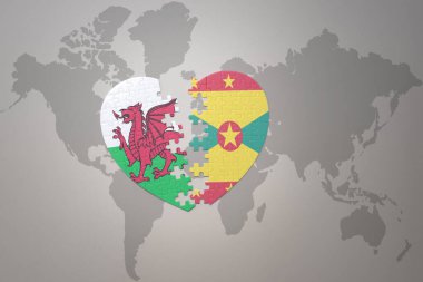 Bir dünya haritasında Grenada ve Galler 'in ulusal bayrağıyla bulmaca kalbi. 3B illüstrasyon