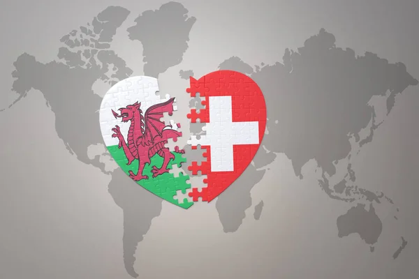 Serce Puzzle Flagą Narodową Szwajcarii Walii Tle Mapy Świata Concept — Zdjęcie stockowe