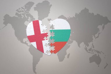 Bir dünya haritasında, İspanya ve İngiltere 'nin ulusal bayrağının bulmaca kalbi. 3B illüstrasyon