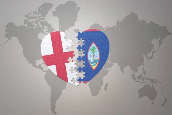 世界地図の背景にグアムとイギリスの国旗が描かれたパズルハート 3Dイラスト — ストック写真