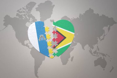 Guyana ve Kanarya Adaları 'nın ulusal bayrağıyla bir dünya haritası üzerinde bulmaca kalbi. 3B illüstrasyon