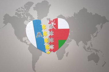 Umman ve Kanarya Adaları 'nın ulusal bayrağıyla bir dünya haritası üzerinde bulmaca kalbi. 3B illüstrasyon