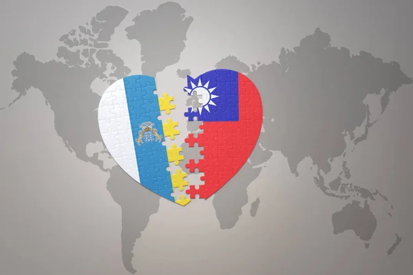 puzzle heart with the national flag of taiwan and canary islands on a world map background.Concept. 3D illustration