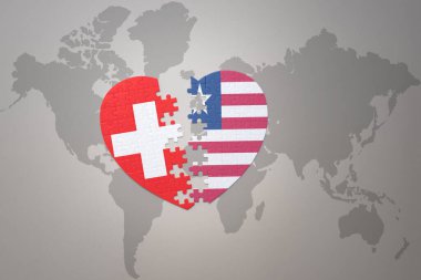 Liberya 'nın ulusal bayrağını taşıyan bir bulmaca kalbi ve bir dünya haritasında yer alan İsviçre. 3B illüstrasyon