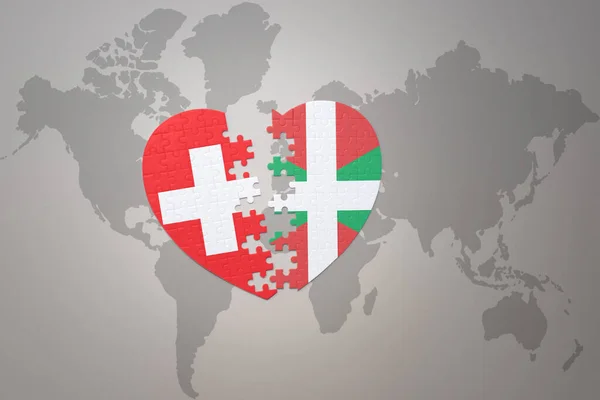 Serce Puzzle Flagą Kraju Basków Szwajcarii Tle Mapy Świata Concept — Zdjęcie stockowe