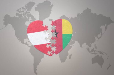 Bir dünya haritasında Gine Bissau ve Avusturya 'nın ulusal bayrağıyla bulmaca kalbi. Konsept. 3B illüstrasyon