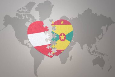 Grenada ve Avusturya 'nın ulusal bayrağını taşıyan bir yapboz kalbi dünya haritasında. 3B illüstrasyon