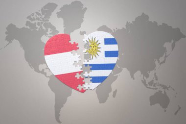 Dünya haritasında Uruguay ve Avusturya 'nın ulusal bayrağıyla bir bulmaca kalbi. 3B illüstrasyon