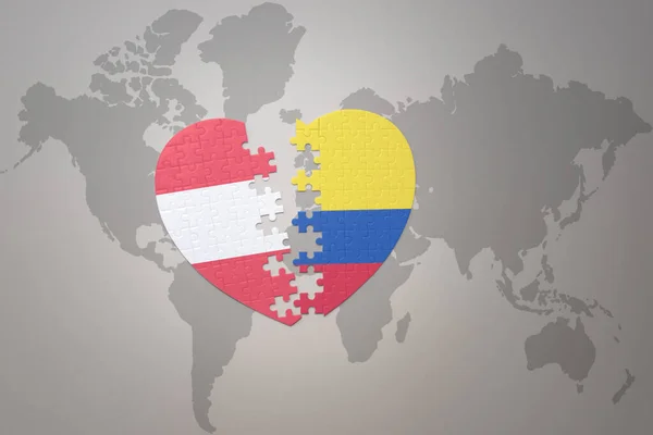 コロンビアとオーストリアの国旗が描かれたパズルハートが世界地図の背景にあります 3Dイラスト — ストック写真