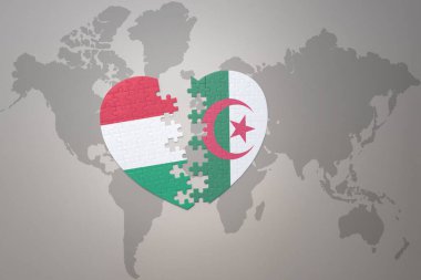 Cezayir 'in ulusal bayrağı ve Hungary' nin yapboz kalbi bir dünya haritasında. 3B illüstrasyon