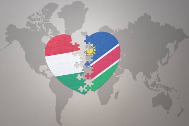 Namibya ve Hungary 'nin ulusal bayrağıyla bir dünya haritasında bulmaca kalbi. Konsept. 3B illüstrasyon