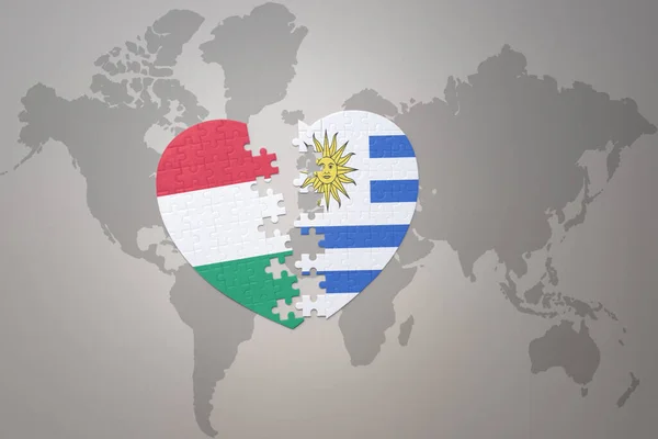 Puzzle Srdce Národní Vlajkou Uruguay Maďarské Pozadí Světové Mapové Koncepce — Stock fotografie