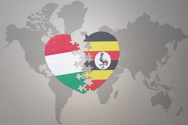 在世界地图的背景上 与乌干达和饥饿的国旗拼凑在一起 3D插图 — 图库照片