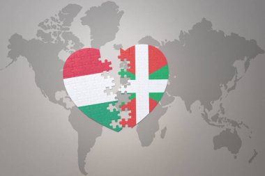 Bask ülkesinin ulusal bayrağıyla bulmaca kalbi ve dünya haritasında Hungary. Konsept. 3B illüstrasyon