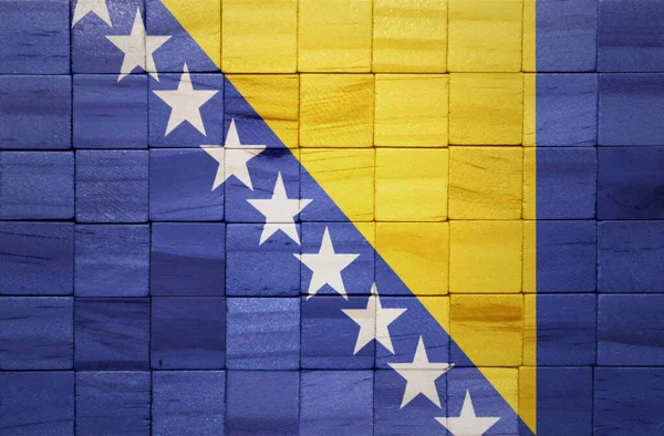 在木制立方体纹理上 彩绘了巨大的波斯尼亚和黑塞哥维那国旗 3D说明 — 图库照片