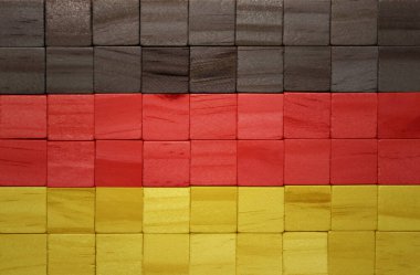 Ahşap bir küpler dokusuna büyük bir Alman bayrağı boyanmış. 3d illüstrasyon