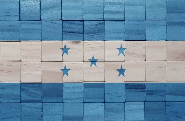 カラフルな絵は木の立方体のテクスチャにホンジュラスの大きな国旗を描いた 3Dイラスト — ストック写真