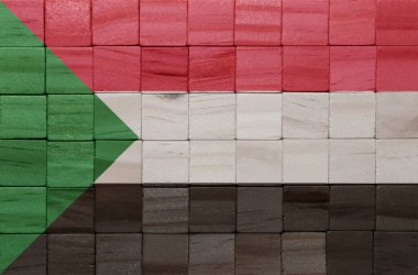 Tahta bir küp dokusuna, Sudan 'ın büyük ulusal bayrağını boyamışlar. 3d illüstrasyon