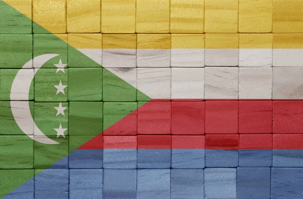 Πολύχρωμα Ζωγραφισμένα Μεγάλη Εθνική Σημαία Του Comoros Μια Ξύλινη Κυβάκια — Φωτογραφία Αρχείου