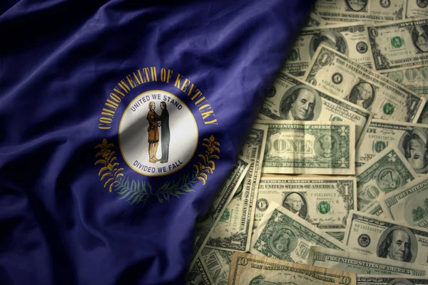 stock image big colorful waving national flag of kentucky state on a american dollar money background. finance concept