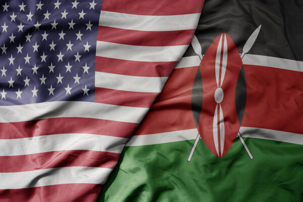 большой разноцветный флаг Соединенных Штатов Америки и национальный флаг Кении. macro