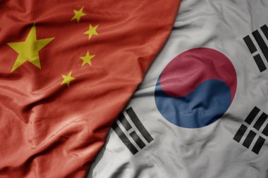 Çin 'in ulusal bayrağı ve Güney Kore' nin ulusal bayrağı sallanıyor. makro