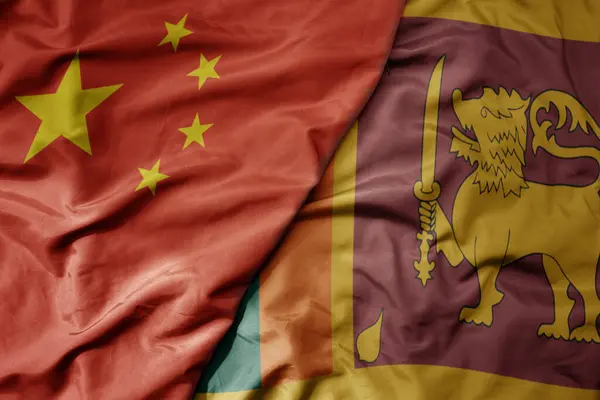 stock image big waving national colorful flag of china and national flag of sri lanka . macro