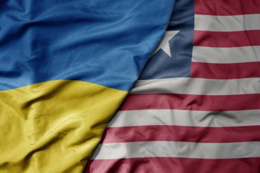 Ukrayna 'nın ulusal bayrağı ve Liberya' nın ulusal bayrağı sallanıyor. makro