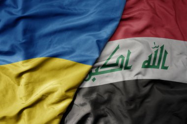 Ukrayna 'nın ulusal bayrağı ve Irak' ın ulusal bayrağı sallanıyor. makro