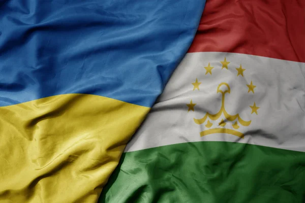 Gran Ondeando Bandera Nacional Colorida Ucrania Bandera Nacional Tayikistán Macro — Foto de Stock