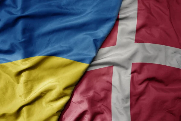 Gran Ondeando Bandera Nacional Colorida Ucrania Bandera Nacional Dinamarca Macro Imagen de archivo
