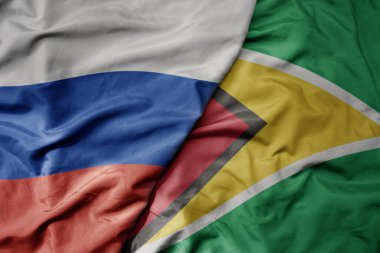Rusya 'nın ulusal renkli bayrağı ve Guyana' nın ulusal bayrağı sallanıyor. makro
