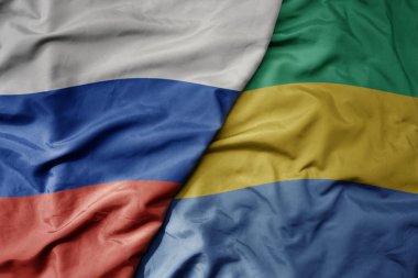 Rusya 'nın ulusal renkli bayrağı ve Gabon' un ulusal bayrağı sallanıyor. makro