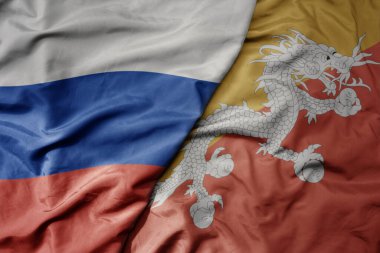 Rusya 'nın ulusal renkli bayrağı ve Butan' ın ulusal bayrağı dalgalanır. makro