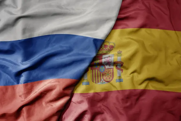 Большой Размахивающий Реалистичным Национальным Красочным Флагом России Национальным Флагом Испании — стоковое фото