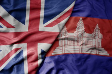 Büyük Britanya bayrağı ve Kamboçya bayrağı sallanıyor. makro