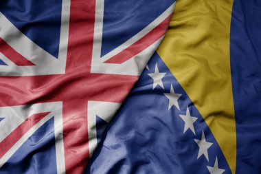 Büyük Britanya bayrağı, Bosna ve Herzegovina 'nın ulusal bayrağı sallanıyor. makro