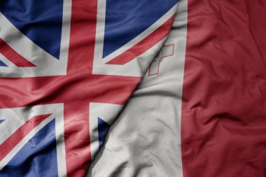 Büyük Britanya bayrağı ve milli malta bayrağı sallanıyor. makro