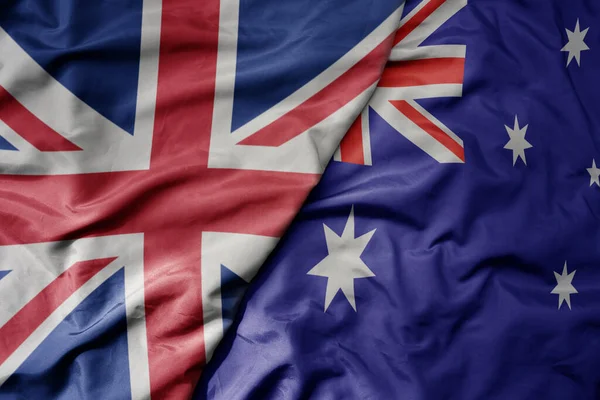 Большой Размахивая Национальным Красочным Флагом Великобритании Национальным Флагом Австралии Macro — стоковое фото