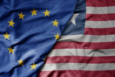 big waving realistic national colorful flag of european union and national flag of liberia . macro clipart