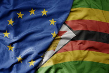 Avrupa Birliği 'nin gerçekçi ulusal bayrağı ve Zimbabve' nin ulusal bayrağı sallanıyor. makro