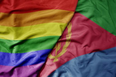 Eritrea ve gökkuşağı eşcinsellik bayrağının büyük, gerçekçi, renkli bayrağını sallıyor. makro