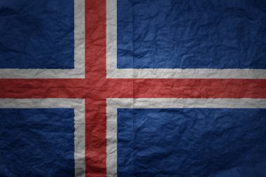 colorful big national flag of iceland on a grunge old paper texture background clipart