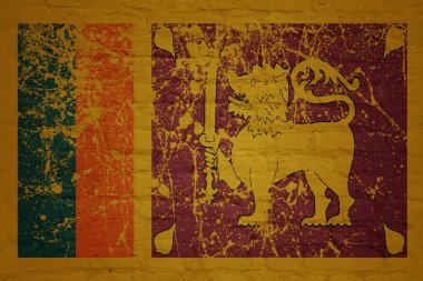 colorful painted big national flag of sri lanka on a massive old brick wall clipart